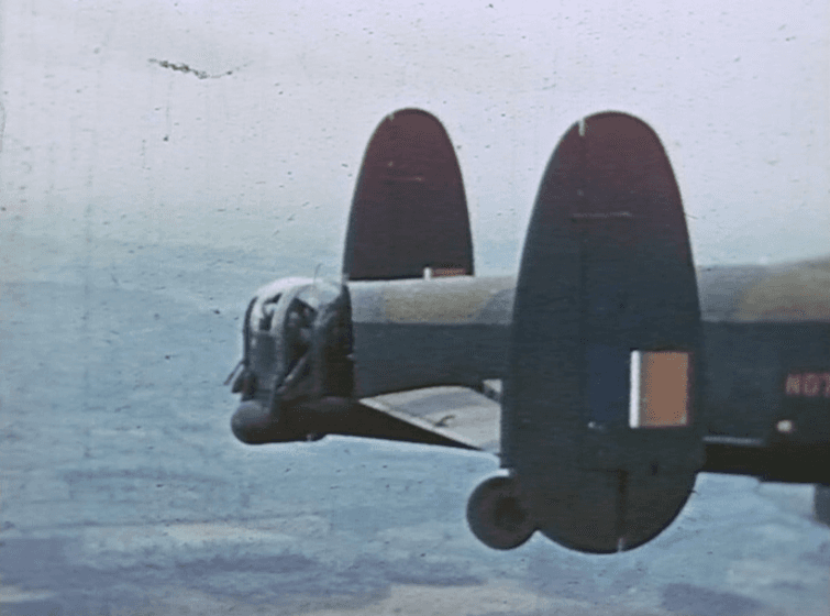 A bomber photographed in flight, colour