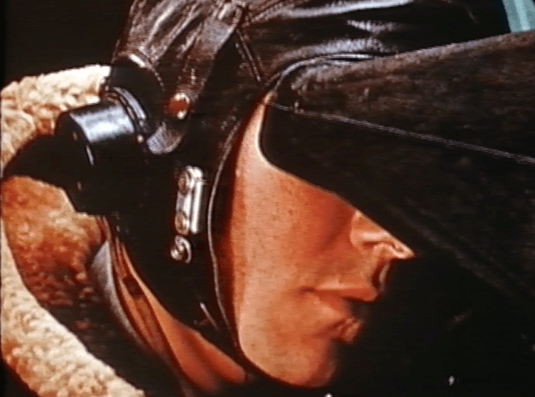 An airman wearing a leather flying helmet